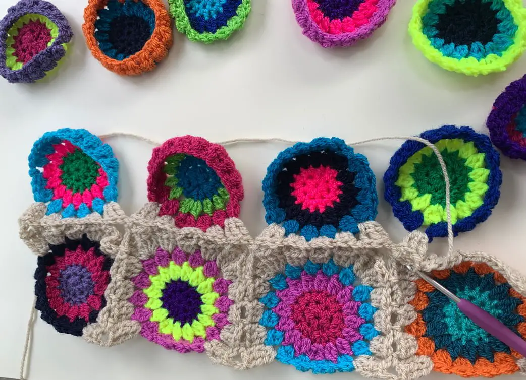 Continuous join as you go starburst granny squares.  